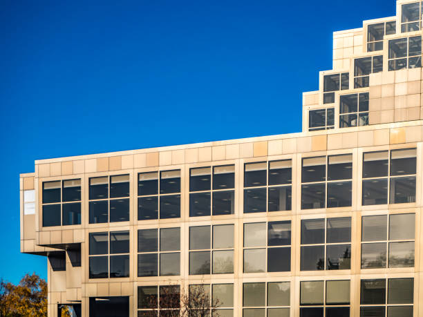 istock Modern office building with windows and blue sky 1480817185