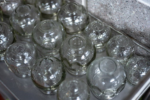 Variety shape and color of empty glass container bottles, reuse waste things for ecology friendly concept, copy space