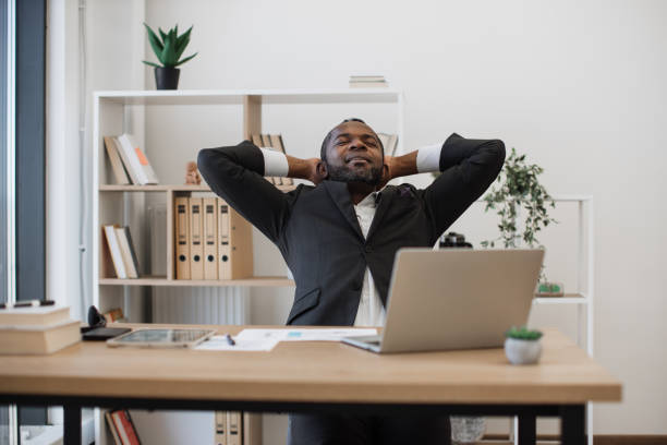 istock African employee with laptop resting from work at office 1480826376