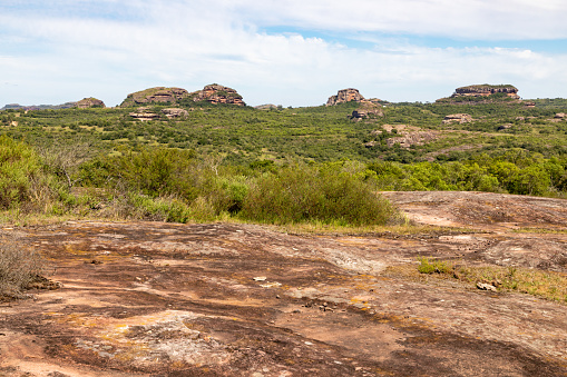 Large rocks in the bushveld landscape in the Kruger National Park in South Africa - If you look carefully it is possible to see two klipspringer antelopes on the top of the rock