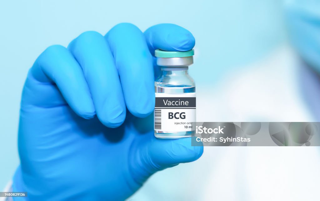 Doctor in protective gloves holding a BCG (tuberculosis) vaccine. Kids vaccine. The concept of medicine, healthcare, science and vaccination awareness. Vaccination Stock Photo