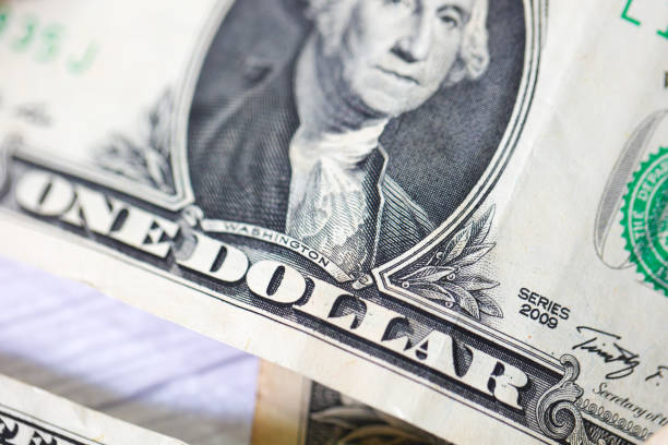 istock One dollar bills on white background. Close-up photo. 1480836302