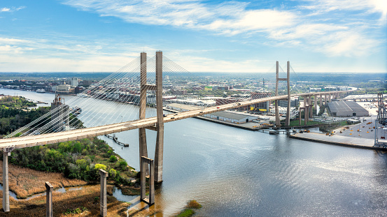 Aerial view of Talmadge Memorial Bridge on a sunny day. The Talmadge Memorial Bridge is a bridge spanning the Savannah River between downtown Savannah, Georgia, and Hutchinson Island.