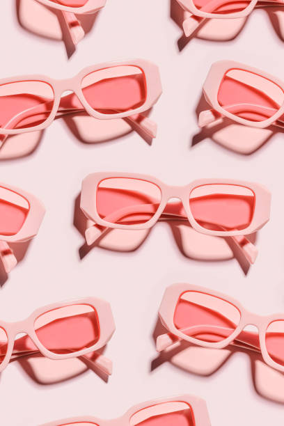 istock Minimal pattern from pink eyeglasses on rose background, visual trends summer concept. Top view aesthetic photo, colored sunglasses as creative geometric pattern, monochrome flat lay glasses 1480839516