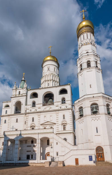 istock Ivan the Great Bell Tower, with Assumption Belfry on the right in Moscow Kremlin. Blue sky background with sunbeams 1480842025