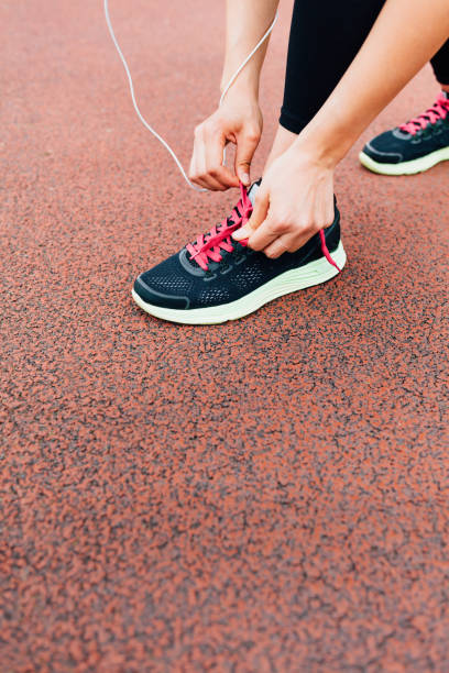 istock Runner preparing gym shoes 1480843136