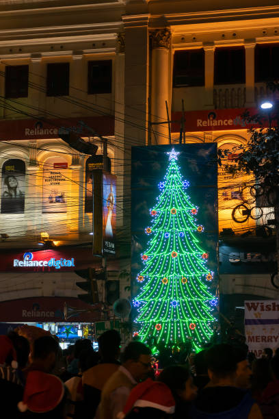 Decorated Christmas tree, lights and Christmas celebration at illuminated Park street with joy and year end festive mood. stock photo
