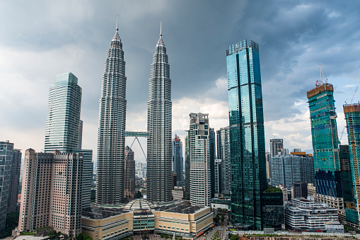 Breath taking view of Petronas twin Towers and Kuala Lumpur skyscrapers view with clouds.