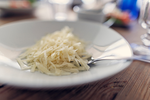 Closeup of grated hard cheese\nCanon R5