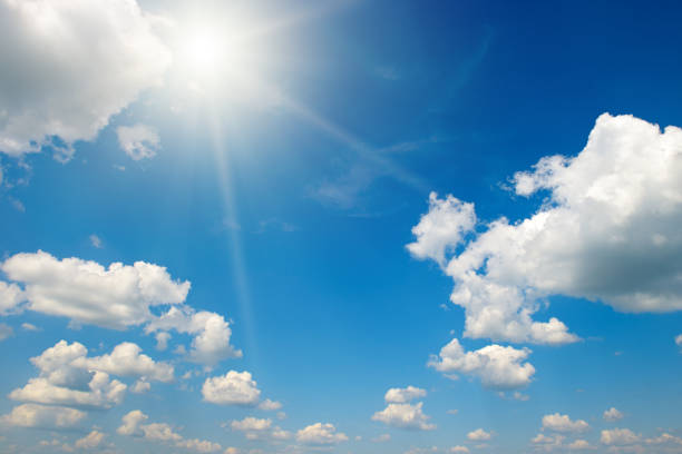 istock Bright sun on beautiful blue sky with white clouds. 1480852606