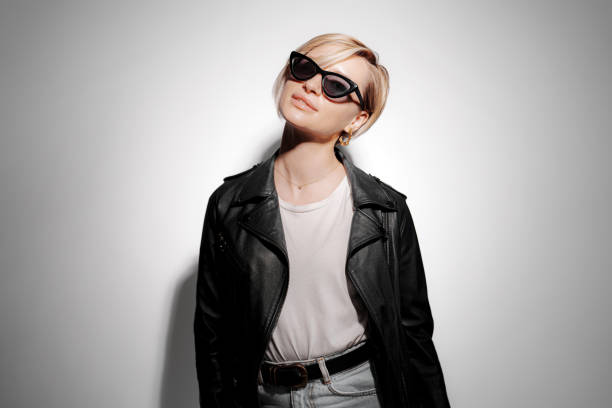 istock Stylish woman in sunglasses and leather jacket 1480854680
