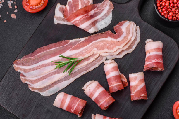 istock Delicious fresh pancetta with salt and spices cut into thin slices 1480855264