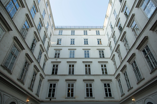 The abstract view of closed yard surrounded by historic building in Vienna old town (Austria).