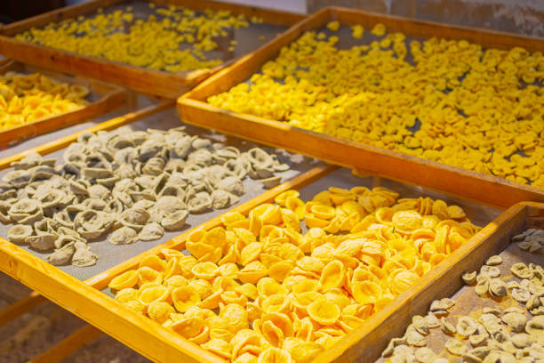 Raw homemade conchiglie pasta on street in Italy. Traditional food. Bari. stock photo