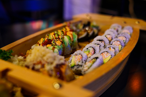 sushi salmon on a plate on dark table