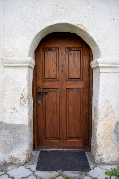 istock Beautiful brown wooden monastery door. 1480860694