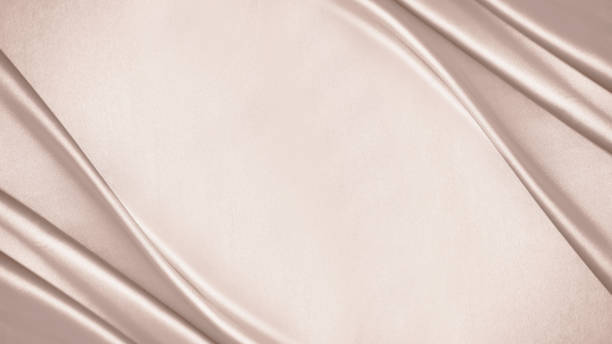 istock Pink beige cream silk satin. Draped fabric. Light pale brown luxury elegant background. Flat lay, top view table. 1480864427