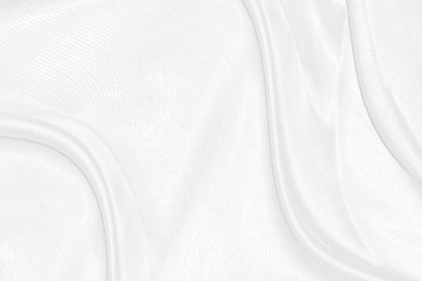 istock Smooth elegant white silk or satin luxury cloth texture can use as wedding background. Luxurious background design 1480867900