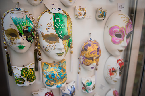 Masks displayed in a shop window in Venice, traditional souvenirs of the Italian city