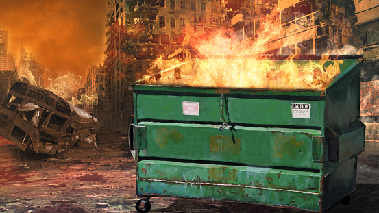 Dumpster Fire Society in Crises features a dumpster with fire coming out the top with a burnt-out city in the background.