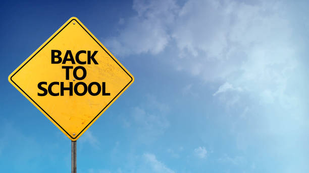 istock Back to School Road Sign Blue Skies 1480870829
