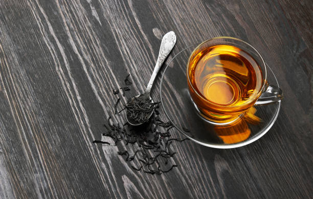 istock Cup of Tea on a dark wood 1480871912