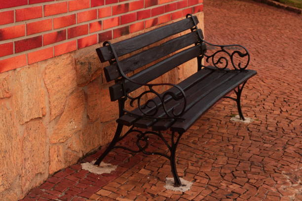 Bench against brick wall