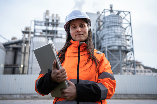 Portrait of smiling female working in the energy industry.