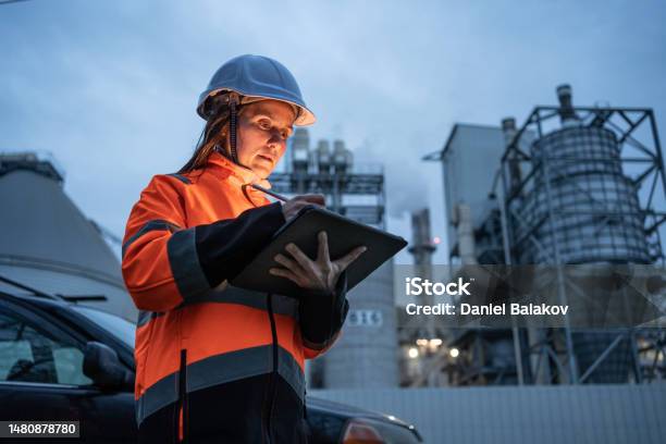 Woman Engineer Working In Power Plant Night Shift Stock Photo - Download Image Now
