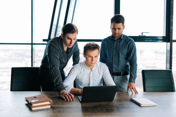 istock Three young men hard at work in their office, typing away on their laptops 1480878832