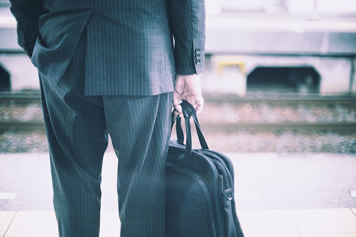 Businessman back view with bag