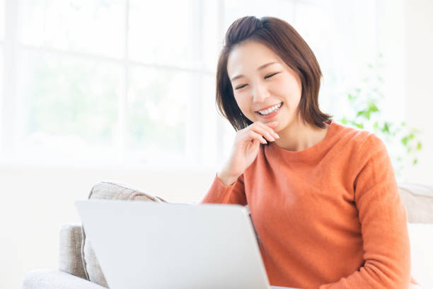 istock young asian woman using laptop 1480888868