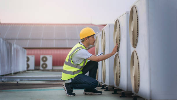 istock Engineers is checking the air conditioning cooling system of a major building or industrial facility. Background is solar cell on the roof. 1480889800