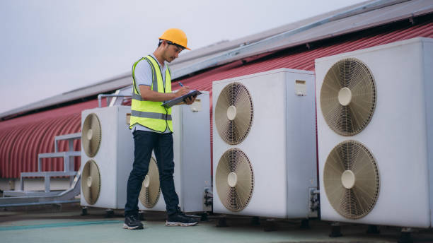 istock Engineers is checking the air conditioning cooling system of a major building or industrial facility. Background is solar cell on the roof. 1480889806