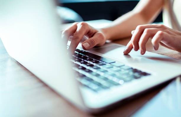istock Young woman working on a laptop at home 1480892349