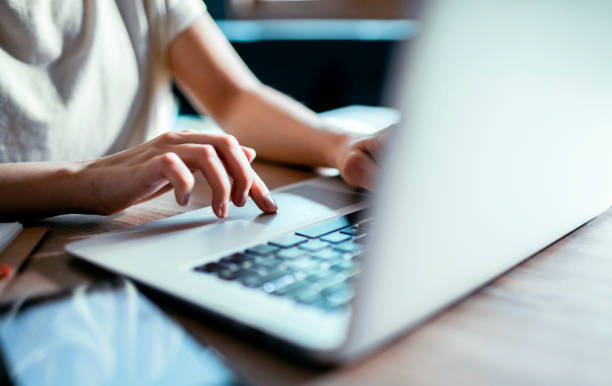 istock Young woman working on a laptop at home 1480892887