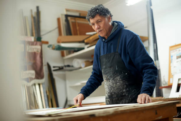 istock Production, manufacturing and man building a frame for construction, architecture and renovation. Woodwork, carpentry and handyman working at a workshop for maintenance, framework and warehouse work 1480894640