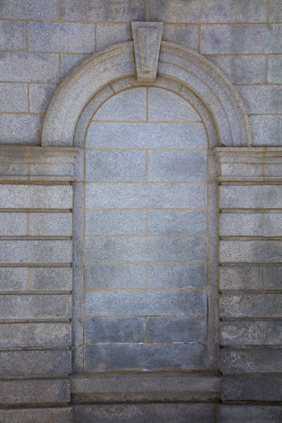 istock granite wall with a shattered window, gothic gray stone background graphic frame arch border background 1480894755