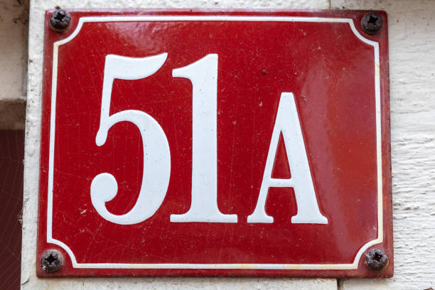 istock 51A number on red metal plaque on white painted timber frame. 1480895553