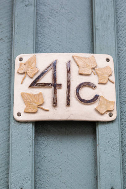 istock 41 number plaque on timber with blue paint peeling show old age and vintage. 1480895575