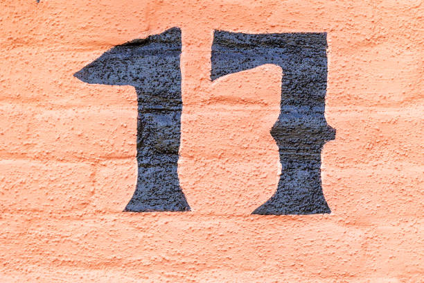 17 number decorative font handpainted on house wall.