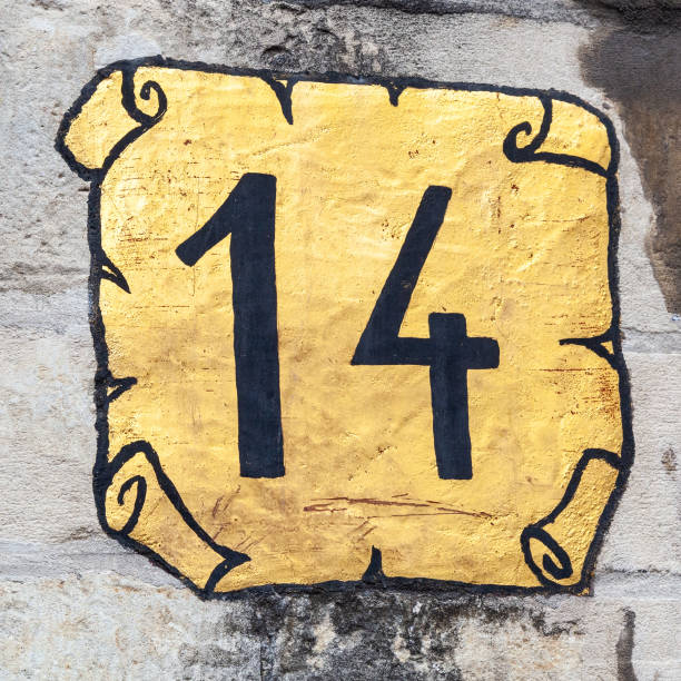 istock 14 number decorative font and gold scroll backgroud handpainted on house wall. 1480895584