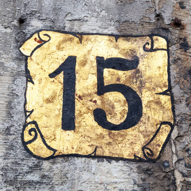 istock 15 number decorative font and gold scroll backgroud handpainted on house wall. 1480895588