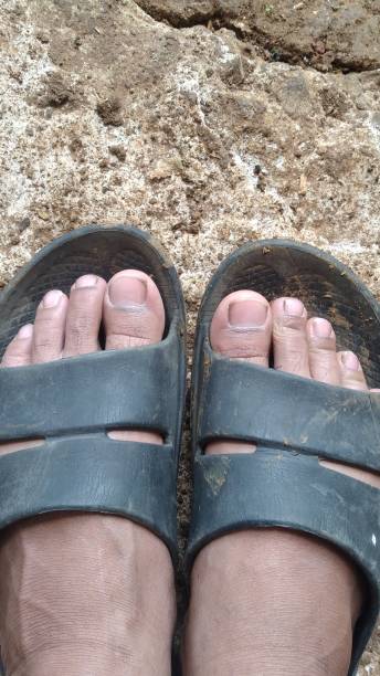 istock dirty feet wearing sandals 1480897157