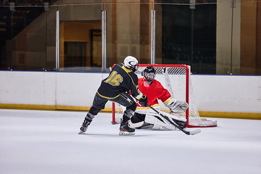 Ice hockey, sport and fitness, athlete in arena playing game, professional player goes for goal, active and sports motivation in Canada ice rink. Exercise, hockey match and competition with training.