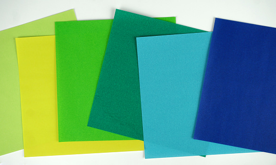 Colorful Paper Notes Arrange on Green Background