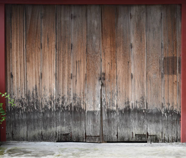 istock Old antique wooden door with iron hinges and hook 1480903596