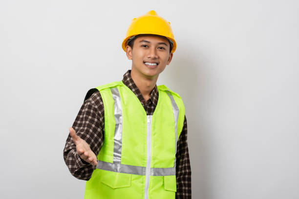 istock Young asian construction worker welcoming offering handshake isolated on white background 1480903678