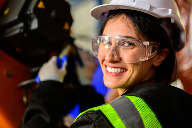 istock Happy female maintenance engineer worker working at industrial factory 1480910349
