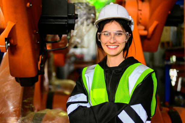 istock Happy female maintenance engineer worker working at industrial factory 1480910389